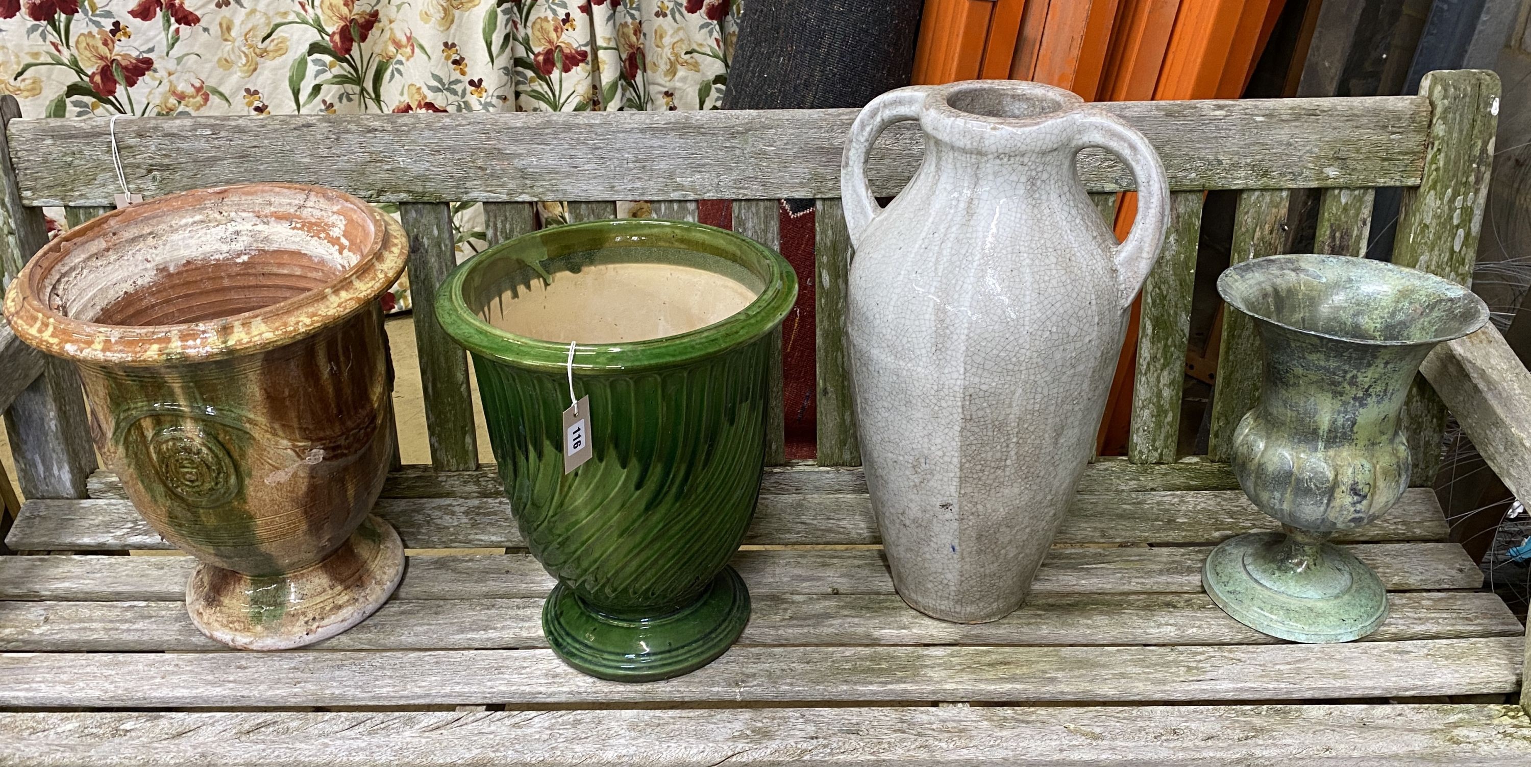 A reconstituted stone circular garden bird bath, diameter 40cm, height 67cm together with two garden planters